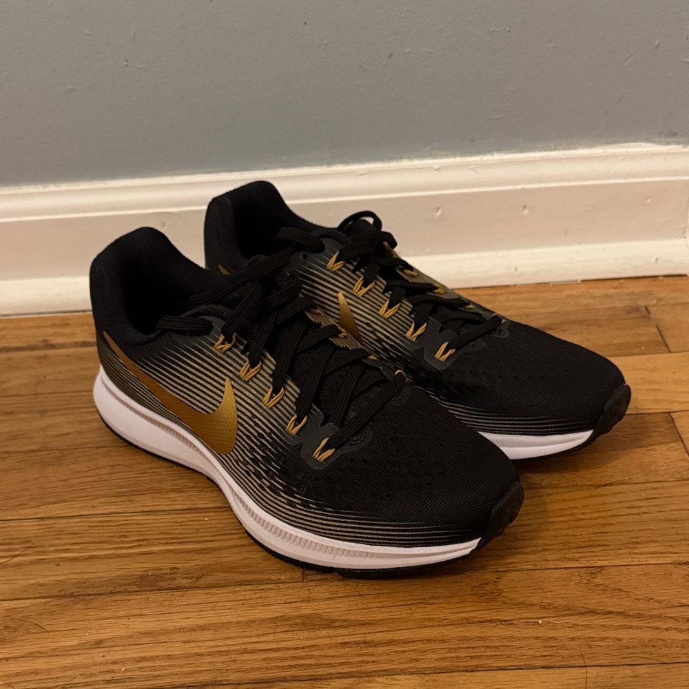 Nike Women’s Black and Gold Athletic Shoes